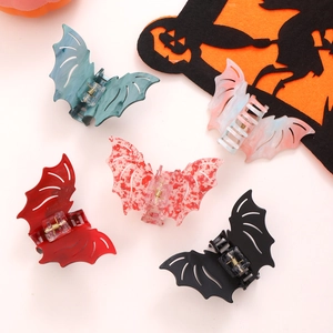 Halloween bat-shaped hair claws in five colors including dark green and red textures