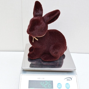 Detail shot showing 42.6g weight of high-density flocked Easter rabbit desktop ornament