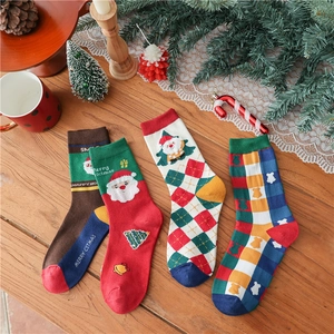 Festive 2-pack Christmas cotton socks in red and green gift box with holiday decor