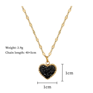 Detail view of gold heart necklace with black pavé crystals and size measurements