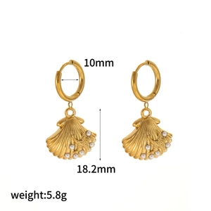 Detail of 18k gold shell earrings with pearl accents showing 18.2mm total height