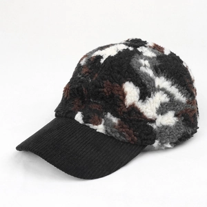 Close-up of winter camouflage baseball cap with plush fleece and corduroy brim detail