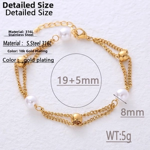 Macro shot of double-layered 18k gold plated titanium chain with pearls and beads