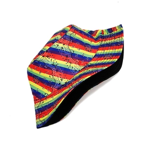 Detailed top-down view of rainbow striped bucket hat with black paisley patterns