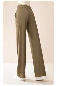 Detail view of high waist drawstring elastic waistband on olive green wide leg yoga pants