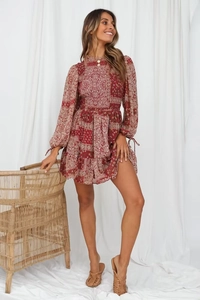 Detailed front view of a red paisley print bohemian mini dress with elastic smocking details