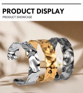 Detailed view of wide open cuffs with water ripple and hammered metal textures