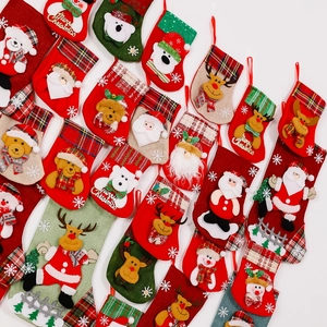 Close-up of assorted festive Christmas stockings with 3D Santa and Reindeer designs