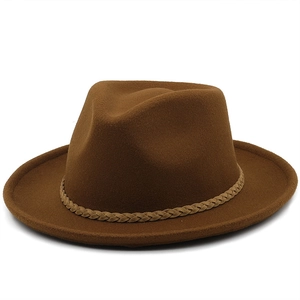 Detail of dark brown wool fedora hat featuring a woven decorative band and smooth texture