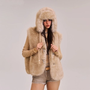 Detailed close-up of faux fur texture with silver metal hook closure on the hooded vest