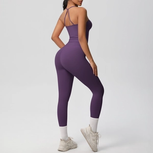 Detail of dark purple yoga set featuring a strapless sports bra and high-waisted leggings