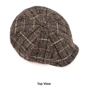 Top view showing herringbone weave and texture detail of a vintage baker boy cap