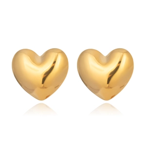 Macro shot of luxury puffy heart earrings in shiny gold finish with sleek reflections