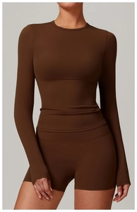 Close-up of deep brown brushed long sleeve yoga top and high waist sports shorts set