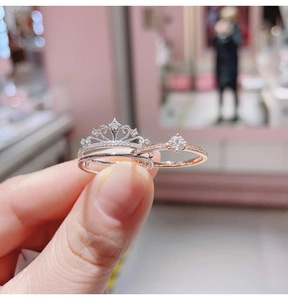 Close-up of two-in-one crown ring set in rose gold and silver with zircon stones