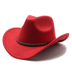 Detail of red wool felt cowboy hat with studded brown leather band on white background