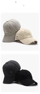 Close-up of distressed cotton baseball caps with torn holes and frayed edges in four colors