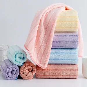 Absorbent coral fleece towels in multi-colored striped pack for home and bath use