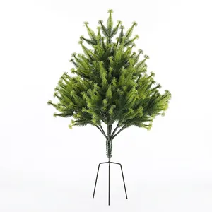 Mini flocked Christmas tree with realistic green needles and stable black metal tripod base