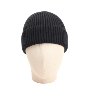 Detail of black ribbed knit beanie showing soft texture and elastic turnover cuff