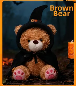 Brown teddy bear in a wizard outfit with a pumpkin candle in a dark forest setting