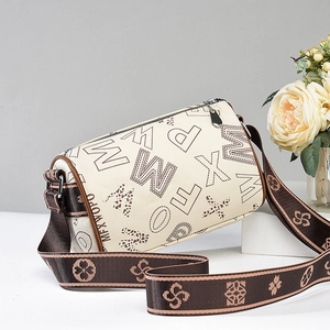 Minimalist beige cylinder shoulder bag with leopard print letters and clover strap