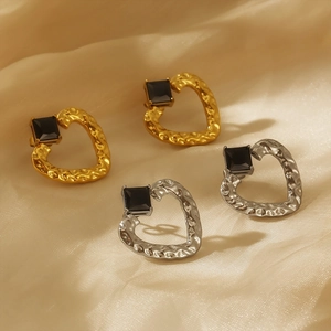 Vintage gold and silver heart earrings with black stone and hammered texture