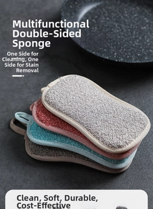 Detail of double-sided dish sponges with hanging loops for kitchen scrubbing and cleaning