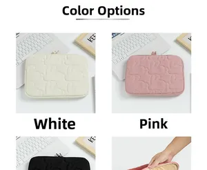 Detailed view of quilted rabbit pattern tablet sleeves in white, pink and black colors
