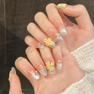 Cat-eye gradient press-on nails with 3D yellow flowers and silver glitter details