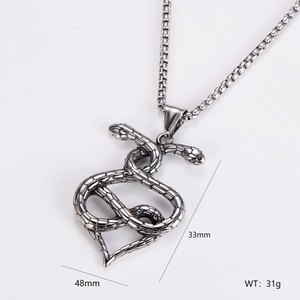 Macro shot of twin intertwined snakes heart pendant measuring 48mm by 33mm in steel