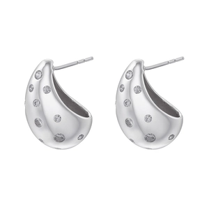 Detailed view of silver teardrop earrings with sparkling zircons and a polished finish