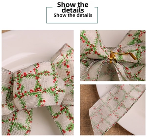 Detail of burlap Christmas bow with pine needle print and silver glitter edges