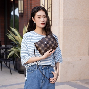 Women's dark brown crossbody bucket bag with geometric printed pattern and PU leather finish
