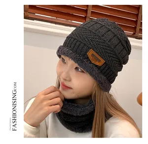 Detail of gray cable knit beanie and neck gaiter set with soft fleece lining