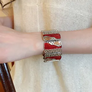 Artistic wide stretch bracelet with colorful enamel inlay and hammered metal plates