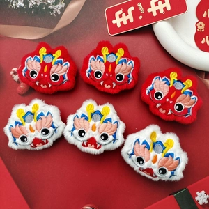 Traditional plush Year of the Dragon embroidery brooches in red and white festive colors