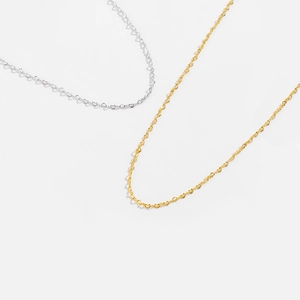 Minimalist S925 sterling silver and gold heart pendant necklaces on white background