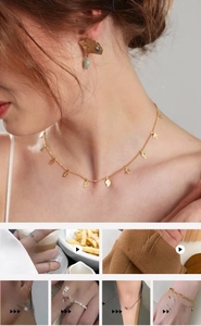 Detailed view of vintage gold leaf necklace and ginkgo charm jewelry on model neck