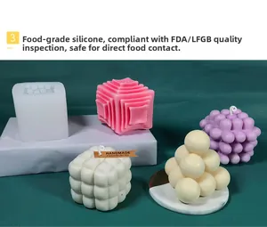 Detailed view of pyramid and bubble silicone molds with finished handmade candles