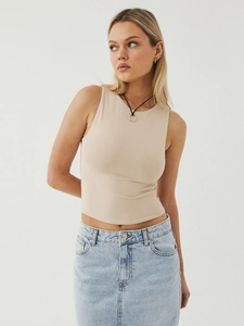 Detail view of beige Y2K cropped ribbed tank top with curved hem and slim fit