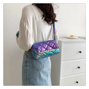 Detail of holographic diamond lattice crossbody bag showing reflective colorful effect