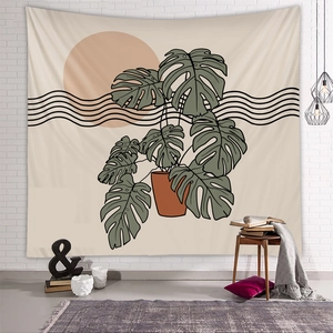 Detail of Nordic monstera tapestry hanging on a white brick wall in a cozy room setting