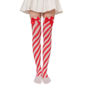 Detail of Christmas over-the-knee socks with red stripes and satin bow on the cuff