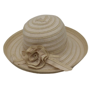 Detail of elegant beige sun hat with woven texture and 3D floral ribbon ornament