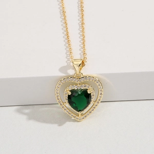 Golden double heart necklace with emerald green zircon and sparkling diamond frame