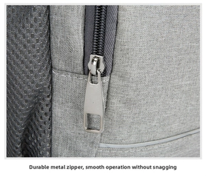 Close-up of durable metal zipper and grey fabric on outdoor thermal backpack