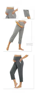 Detail view of high-waist maternity leggings with V-shaped belly support and side pockets