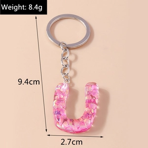 Pink resin letter U keychain with sequins and dimensions: 9.4cm length, 2.7cm width