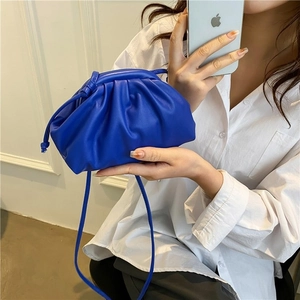 Minimalist deep blue pleated dumpling bag with soft faux leather and crossbody strap